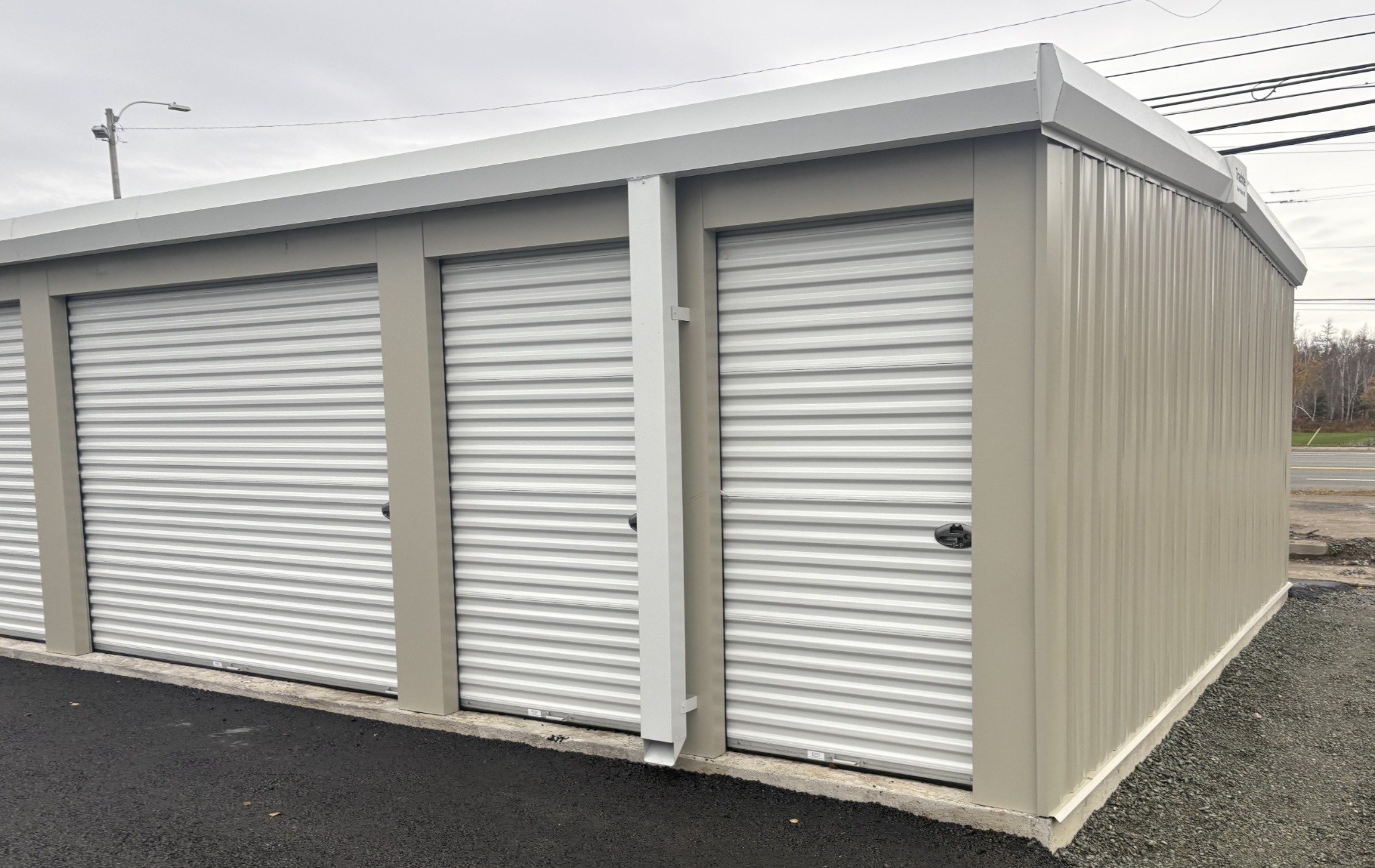 Angled view of DOMTOR Storage units and paved drive-up access